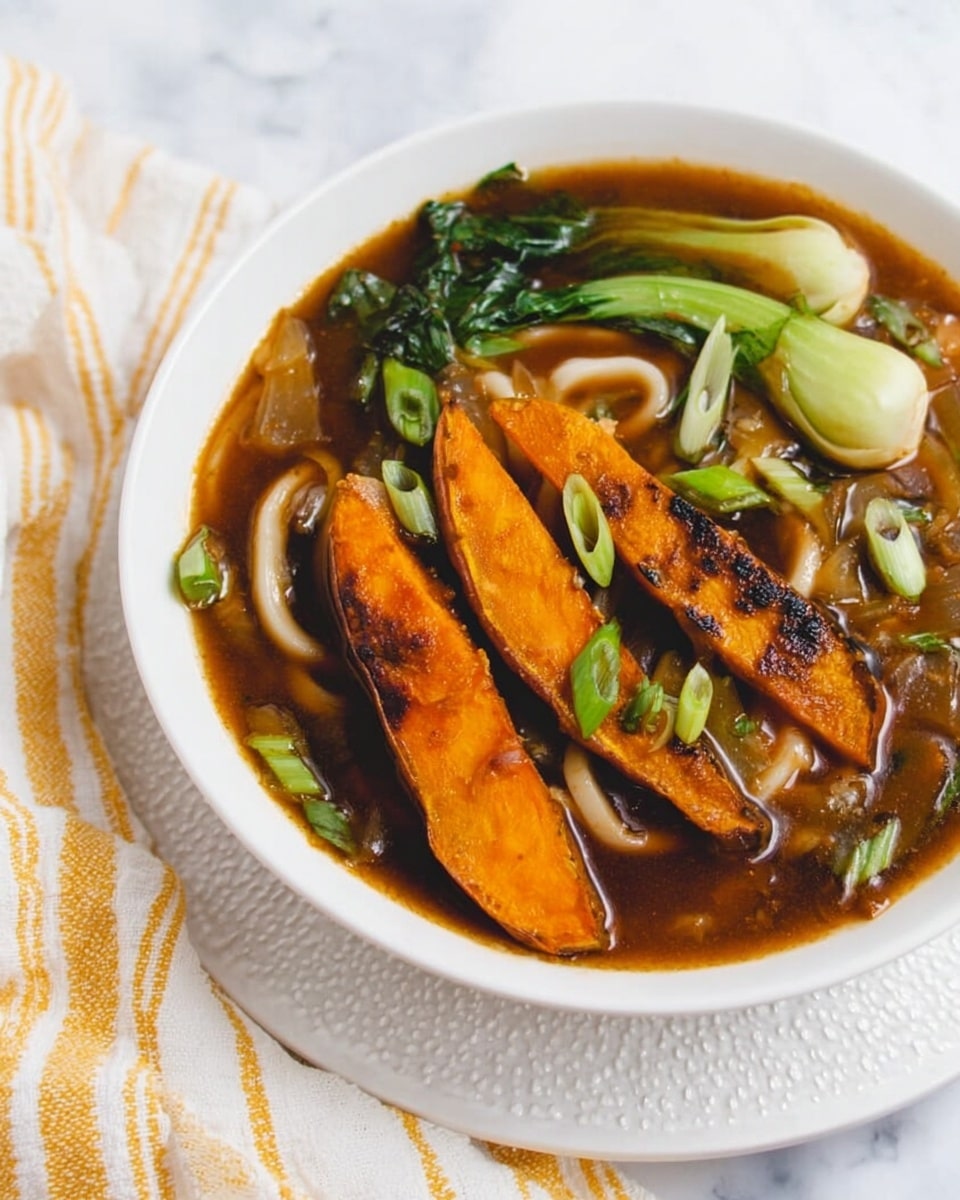 A white bowl filled with a dark brown broth holding thick white noodles and green bok choy leaves, topped with two grilled orange sweet potato wedges with dark char marks, and garnished with thin green scallion slices scattered on top and floating in the soup. The bowl sits on a white textured plate, placed on a white marbled surface with a white cloth and yellow-striped towel beside it, and a woman's hand visible near the edge. Photo taken with an iphone --ar 4:5 --v 7